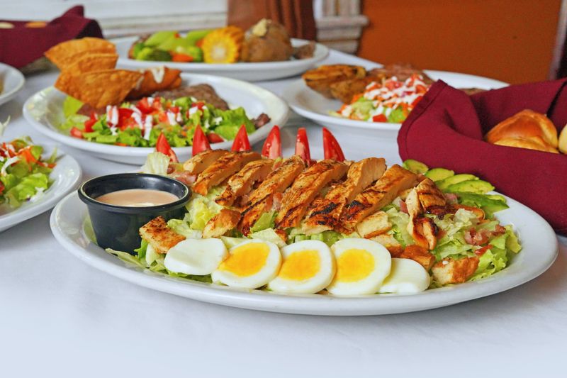 Grilled chicken salad with avocado and tomato