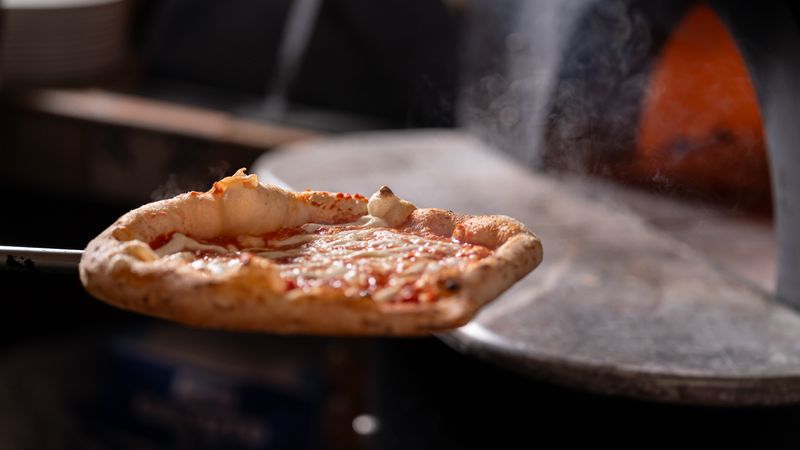 Classic pepperoni pizza from dewey's pizza — a crowd favorite