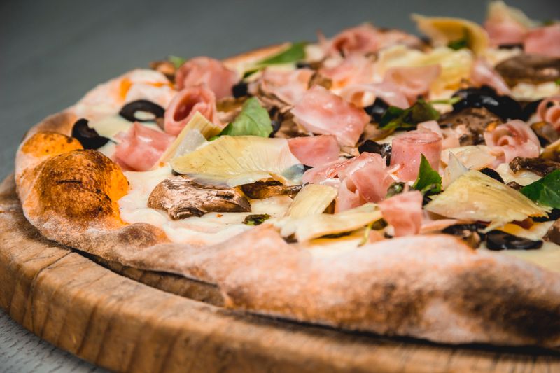 Colorful veggie delight pizza at Dewey's — fresh toppings