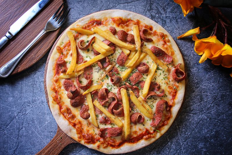 Dewey's premium white truffle pizza — a signature specialty