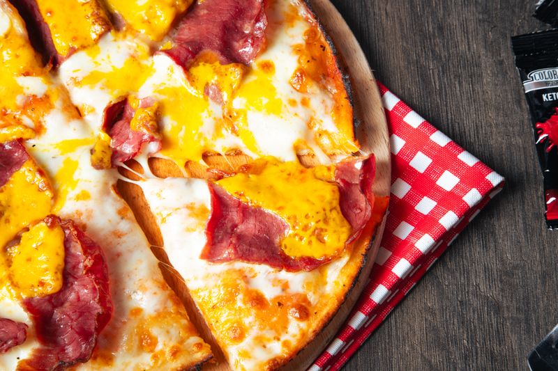 Four cheese pizza sensation — mozzarella, cheddar, gouda, parmesan